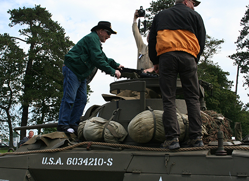 men standing on tank